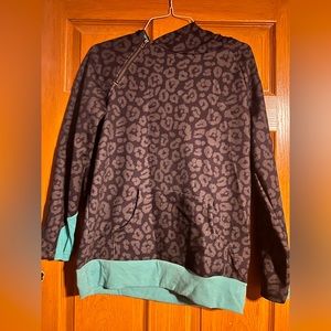 Crazy train black cheetah with turquoise. Size large. Side zipper.